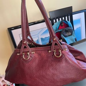 Burgundy GG Gucci hobo with gold hardware